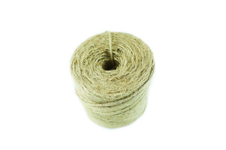 Skein of jute twine threads isolated on white background. Natural fiber for work and creativity.