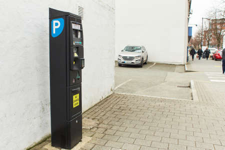 Dublin, Ireland - 04.01.2021: Modern parking pay station on a street allow parkers pay by card or cashのeditorial素材