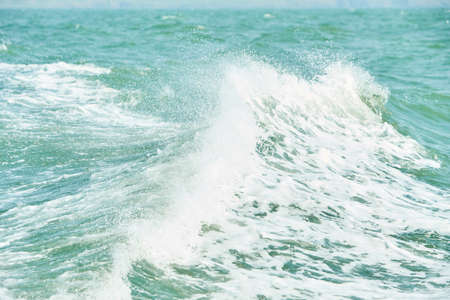 Texture of white wave in the ocean.