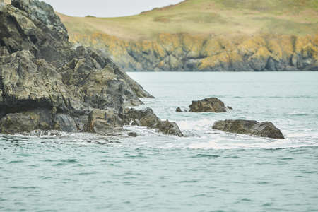 Rocks covered with moss on the sea island coast.の写真素材
