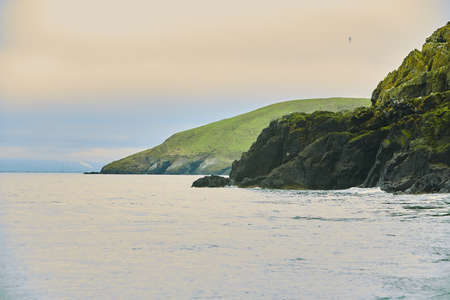 Rocky island covered with moss on the sea island coast.の写真素材