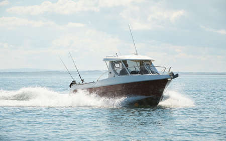 Fast boat on wavy blue sea. luxury motor boat in navigation