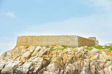 Blue sky and sunny day with Fort, Martello tower, Saint Begnet's Church on Dalkey Island, County Dublin, Ireland.の写真素材