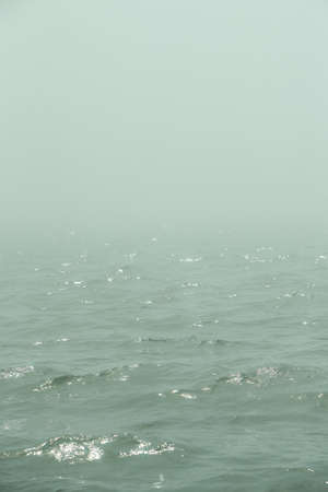 The sea in the fog. The line of the horizon, dissolving in the mist. Irish sea in fog. Foggy weather
