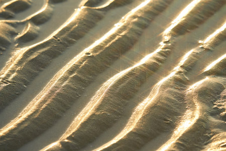 Texture of glitter water and soft waves. sparkling in water - background. sea water with sun glare and ripple. Powerful and peaceful nature concept.の写真素材