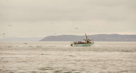 Fishing boat in the open sea.の写真素材