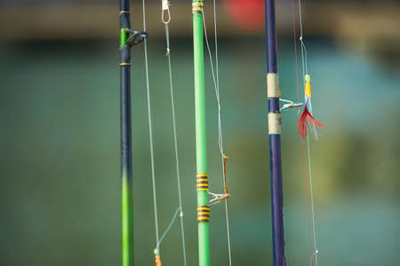 Fishing rods with hooks on the boat in natural setting. Closeupの写真素材
