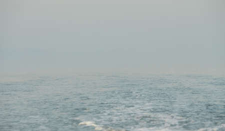 The sea in the fog. The line of the horizon, dissolving in the fog. Irish sea in fog. Foggy weatherの写真素材