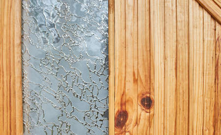 Glass embedded in wooden planks for background.