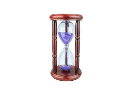 Wooden hourglass with violet sand isolated on white background