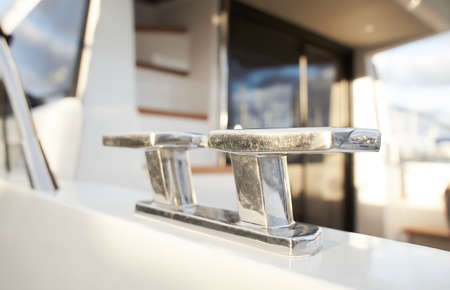 Mooring rope and bollard on sea water and yachts backgroundの写真素材