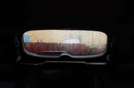 Car Care Business. Automatic Car Wash Process. Spray foam bubble shampoo on the car surface and...
