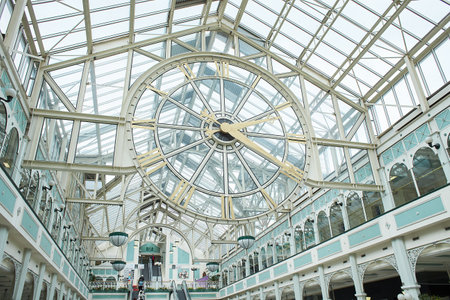Dublin, Ireland - 04.10.2022: Big clock of St Stephen's Green Shopping Centre, Dublin, Ireland. Insideのeditorial素材
