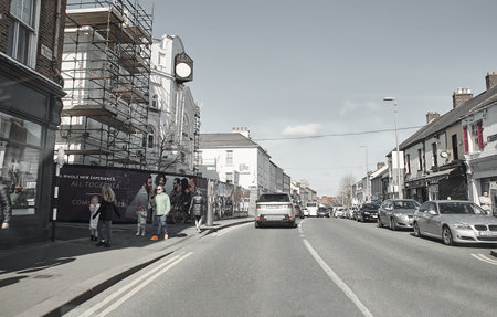 Naas, Ireland - 04.03.2022: Ireland's streets with cars, garda  pedestrians, people and cyclists.