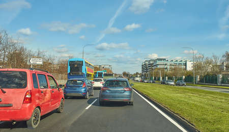 Ireland's streets with cars, garda  pedestrians, people and cyclists. Tallaght