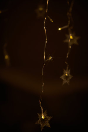 Holiday electric gold, yellow garlands.Christmas tree decoration.