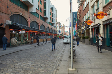 Dublin, Ireland - 01.27.2023: The Pub landmark in Dublin's cultural quarter visited by thousands of tourists every year. People around The pub.のeditorial素材