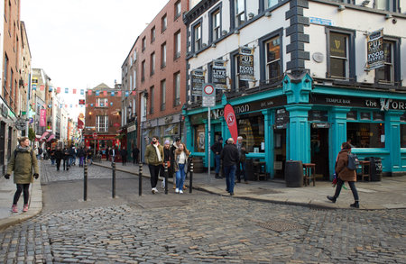 Dublin, Ireland - 01.27.2023: The Pub landmark in Dublin's cultural quarter visited by thousands of tourists every year. People around The pub.のeditorial素材