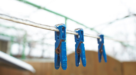 Clothespin and Clothes Line with Icicles and Frozen Water Drops