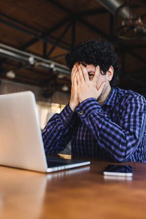 Male freelancer made a huge fuckup on a new projectの写真素材