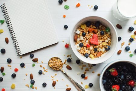 watermelon slices with heart-shaped, almonds, blueberries with granola in bowlの写真素材