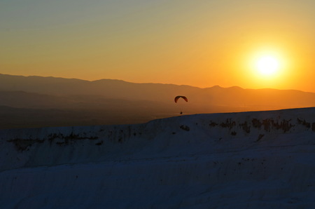 Sunset over the travertine pools and terraces in Pamukkale.の写真素材