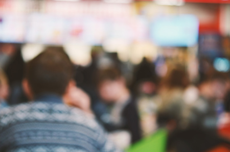 Blurred background. Blurred silhouettes of sitting people in coffee