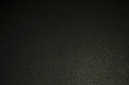 Structure of dense dark cardboard. Cardboard paper texture for background and designの写真素材