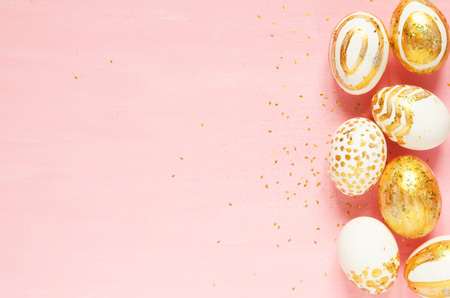 Top view of easter eggs colored with golden paint in differen patterns. Copy space. - Image