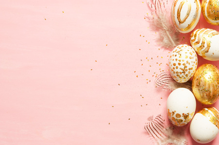 Top view of easter eggs colored with golden paint in differen patterns. Copy space. - Image