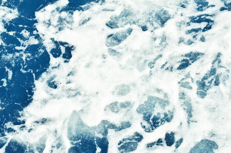  Abstract blue sea water with white foam for background, nature background concept.- Imageの写真素材
