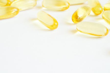 Omega 3 fish oil capsules. Concept of healthcare.  Copy space.