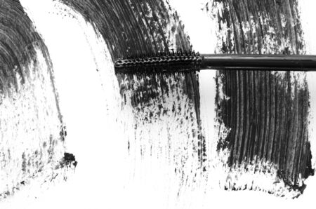 Stroke of black mascara with applicator brush close-up, isolated on white background. - Imageの写真素材