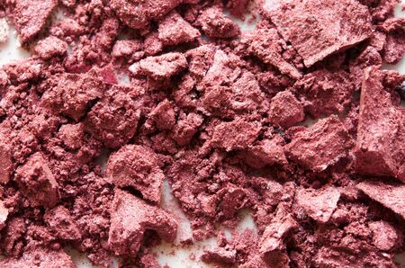 Eyeshadow cosmetic powder scattered. The concept of fashion and beauty industry. Close-up. - Image