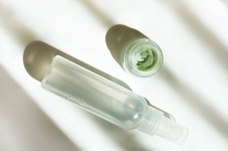 Facial cream and thermal water on white background. Skin care concept. Natural hard light, deep shadows. - Imageの写真素材