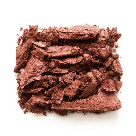 Eyeshadow sample isolated on white background. Crushed brown metallic eyeshadow. The concept of fashion and beauty industry. Close up. - Imageの写真素材