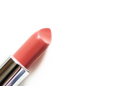 Coral lipstick isolated on white. The concept of fashion and beauty industry. Close up. - Imageの写真素材