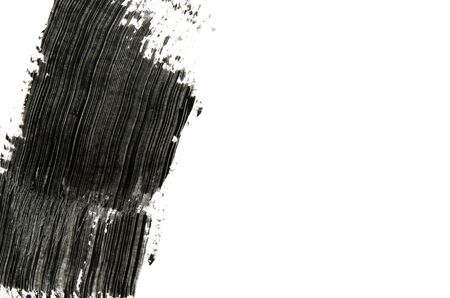 Black mascara brush strokes isolated on white. Copy space. - Imageの写真素材