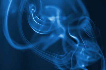 The smoke from the incense sticks. Abstract art. Soft focus. Color of the year 2020 Classic Blue. - Imageの写真素材