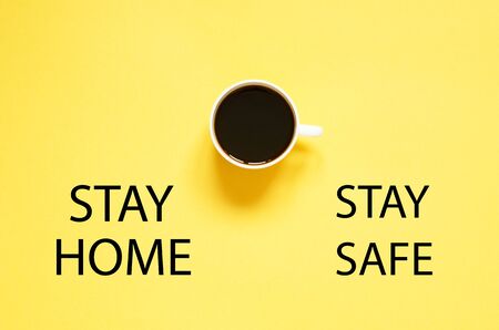 Stay home and stay safe. Self isolation and quarantine campaign to protect yourself and save lives. Flat lay cup of black coffee.の写真素材