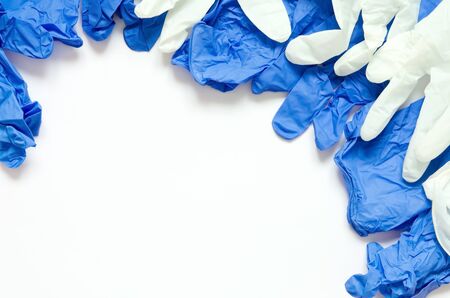 White and blue surgical gloves isolated on white background.の写真素材