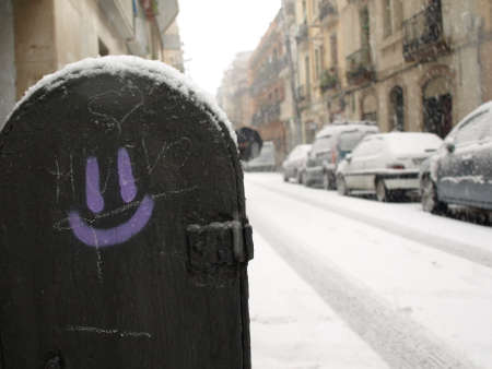 Smiley fountain covered by snow in a snow stormの写真素材