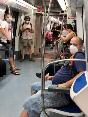 Barcelona, Spain, July 15, 2020: Passengers in protective masks standing in the metro of Barcelonaのeditorial素材