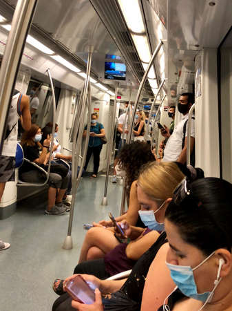 Barcelona, Spain, July 15, 2020: Passengers in protective masks standing in the metro of Barcelonaのeditorial素材