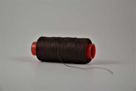 Colored thread coils on white desk. Place for textの写真素材