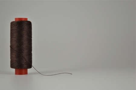 Colored thread coils on white desk. Place for textの写真素材