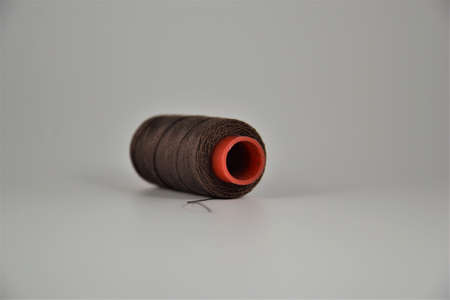 Colored thread coils on white desk. Place for textの写真素材
