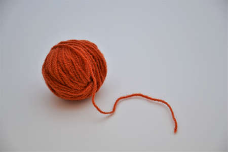 Colorful red ball of wool isolated on a white backgroundの写真素材