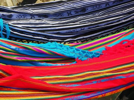 Ecuadorian multi-colored hammocks hanging in the street market. Pattern backgroundの写真素材