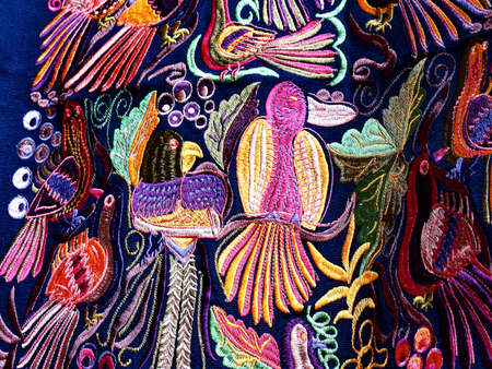 Close up of Ñolorful embroidered decorative textile from Otavalo city at the artisans marketの写真素材